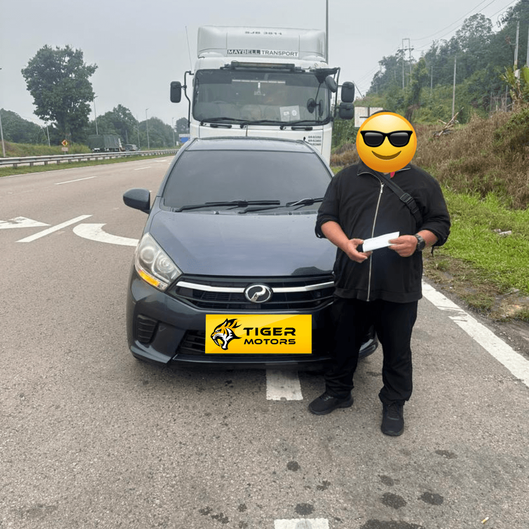 Customer collecting their 2019 Perodua Axia from Tiger Motors in Kuching, Sarawak