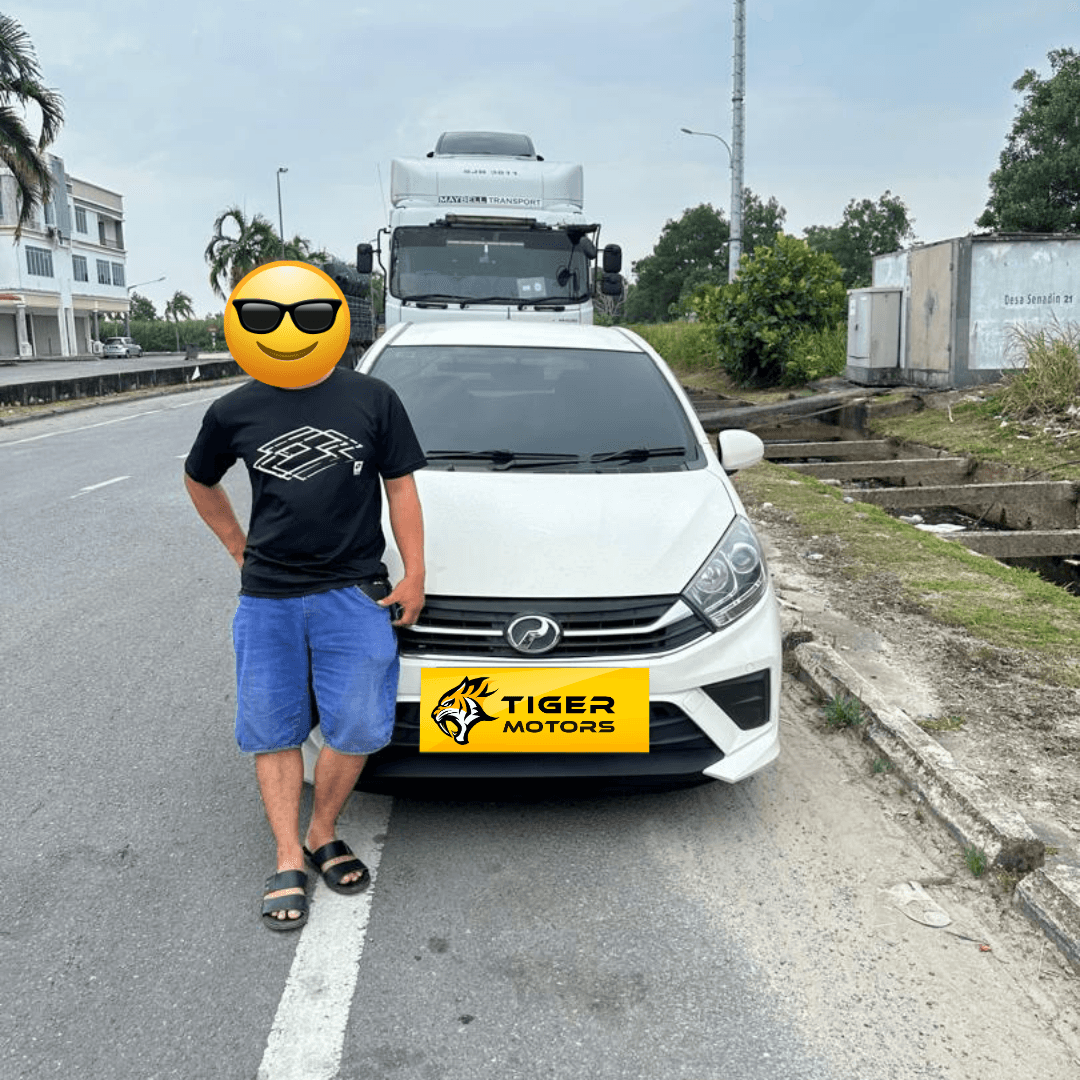 Customer collecting their 2021 Perodua Axia from Tiger Motors in Kuching, Sarawak