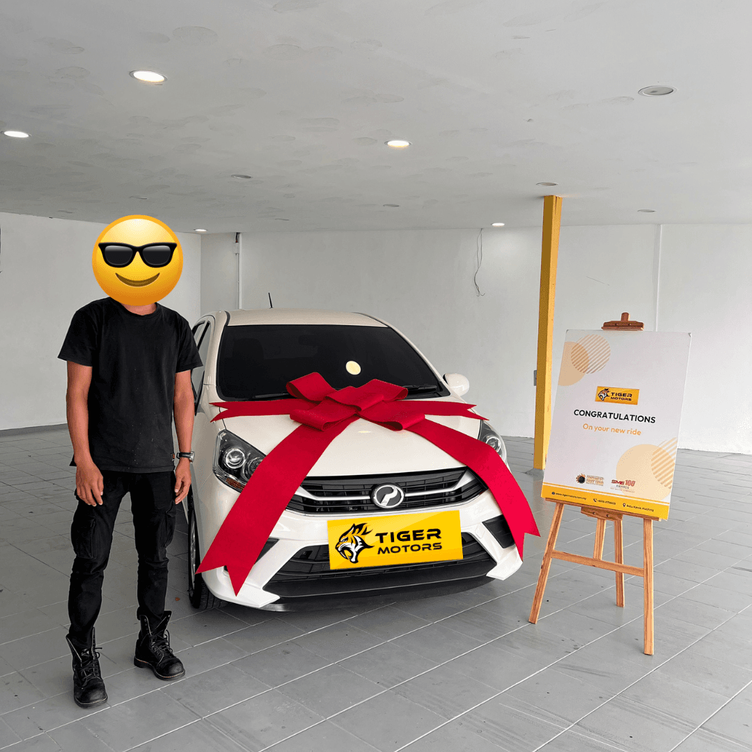 Customer collecting their 2020 Perodua Axia from Tiger Motors in Kuching, Sarawak