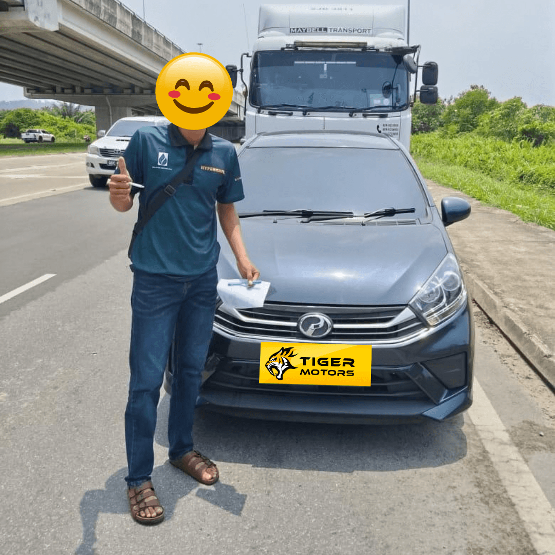 Customer collecting their 2021 Perodua Axia from Tiger Motors in Kuching, Sarawak