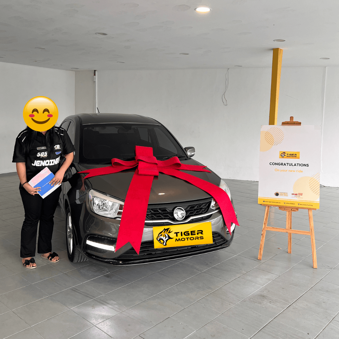Customer collecting their 2022 Proton Saga from Tiger Motors in Kuching, Sarawak